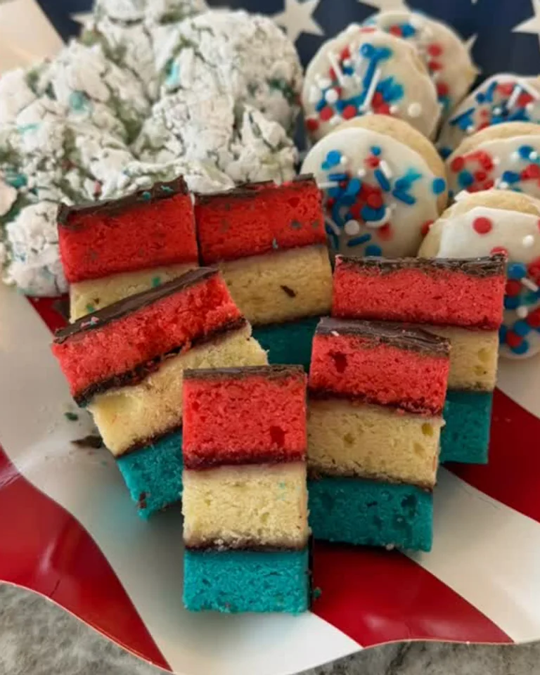 Tricolor cookies in a red, cream, and blue seasonal presentation previously shared by The Cookie Cartel NJ.